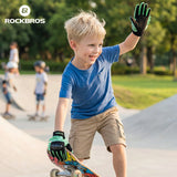 Child on a skateboard with 'RockBros' logo in the background #color_green